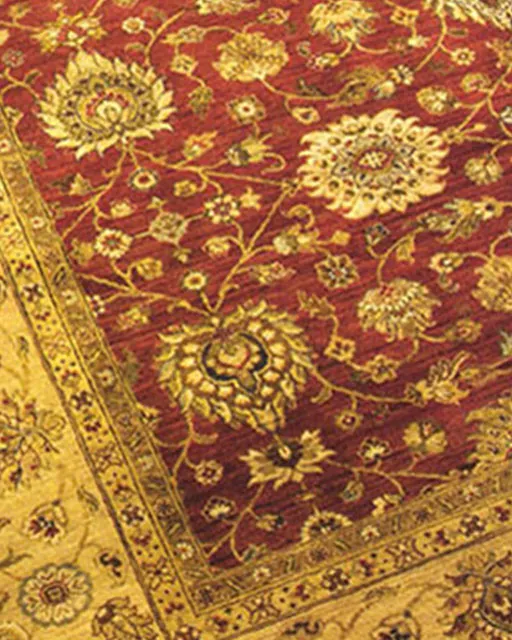 Red oriental rug with gold border after cleaning