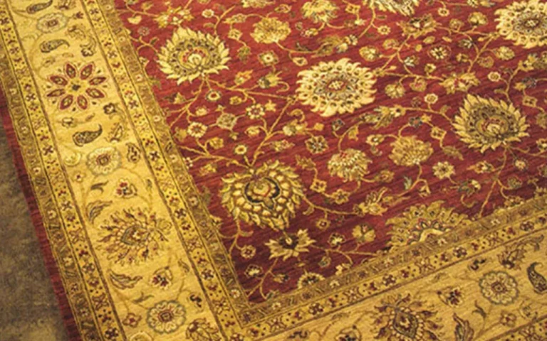 Red oriental rug with a gold border