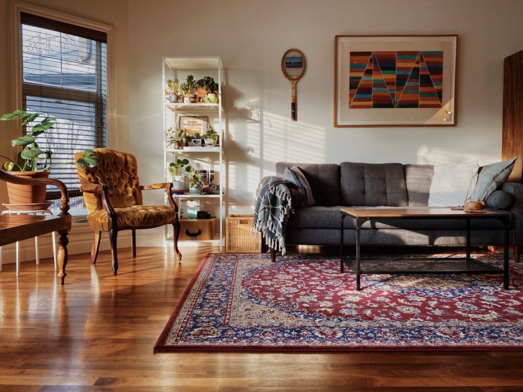 sunlit room with a rich red-and-blue clean Persian-style rug